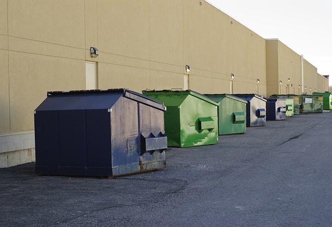 heavy-duty roll-off dumpsters outside a construction zone in Bolton